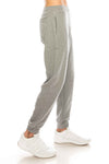 Side View French Terry Fleece Pants: Cozy fleece bottoms for easy, warm, and functional wear. 60/40 Cotton/Poly blend, elastic waist/ankle, side pockets. Sizes XS-XL, colors: Black, Heather Grey, Charcoal, Wood Camo, City Camo. 