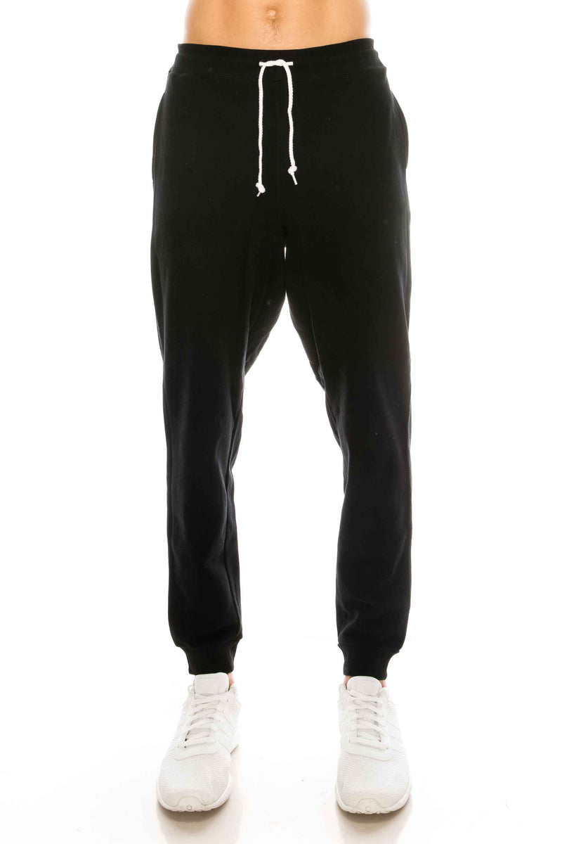 French Terry Black Fleece Pants: Cozy fleece bottoms for easy, warm, and functional wear. 60/40 Cotton/Poly blend, elastic waist/ankle, side pockets. Sizes 2XL-5XL, colors: Black, Heather Grey, Charcoal, Wood Camo, City Camo. 
